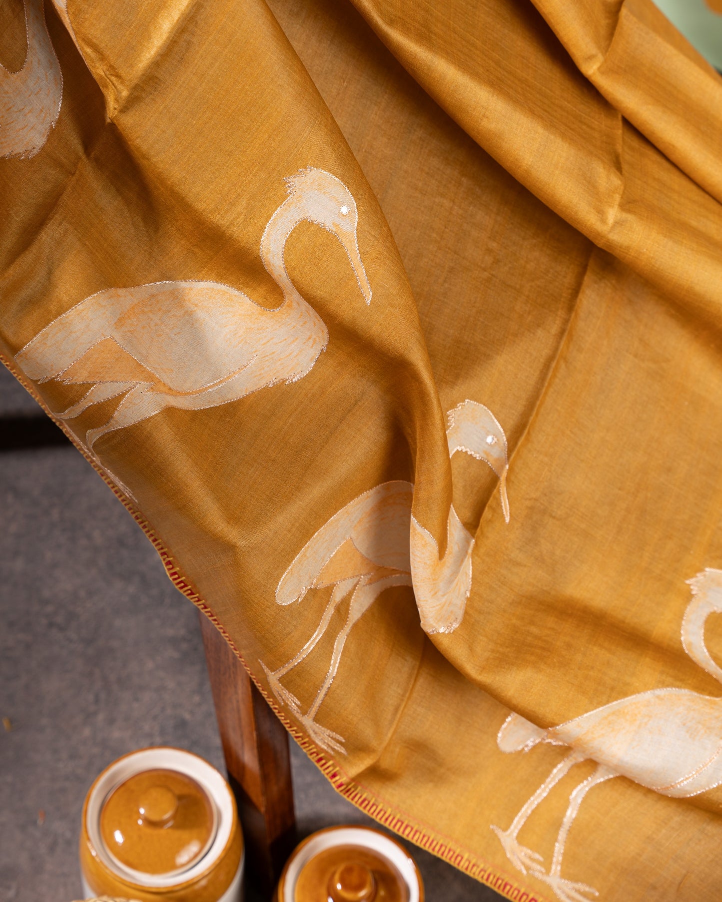 Mustard Tussar Floral Saree with Gold Zari and Red Border