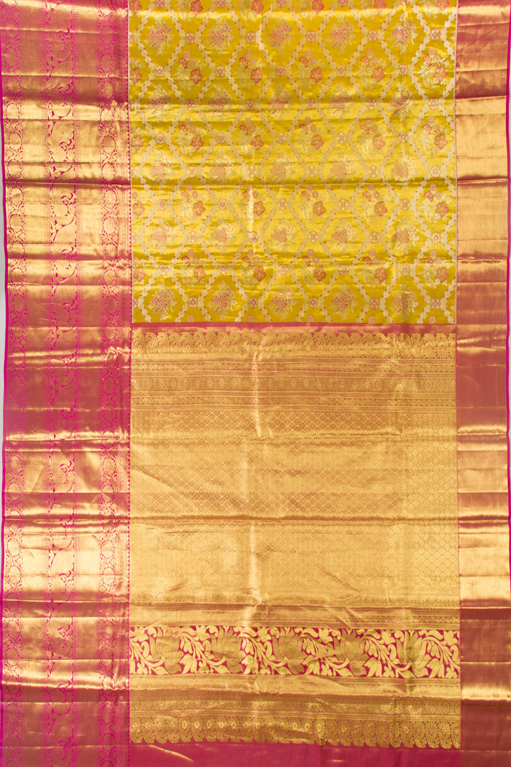 Taranga Kanchi Silk Tissue Jaal and Butta Gold Saree