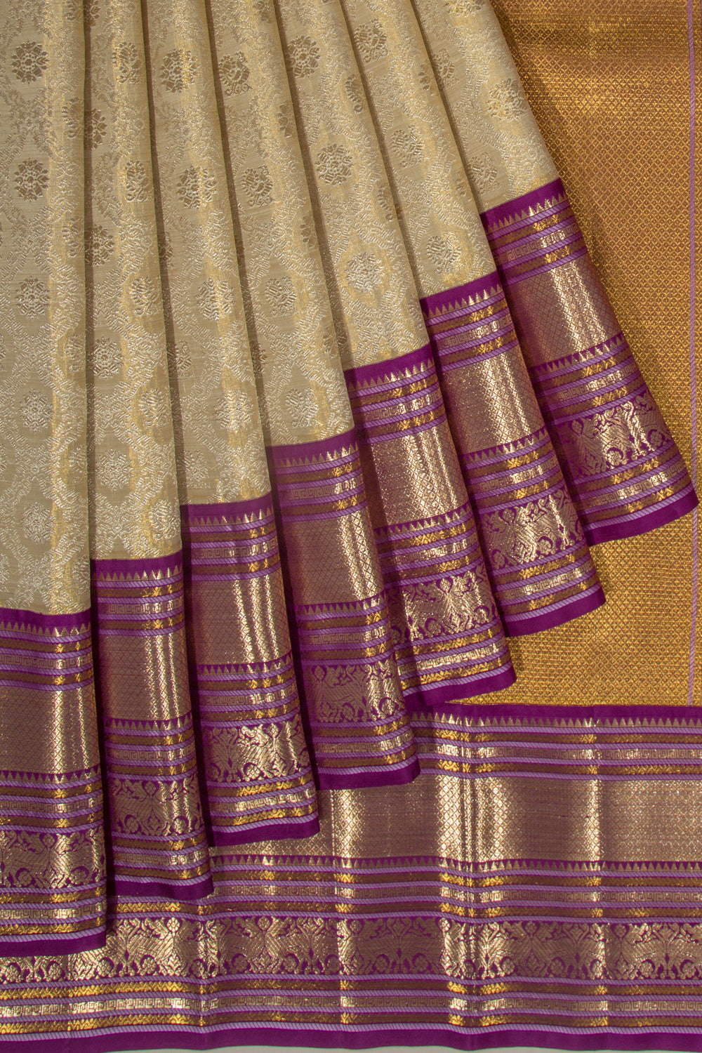 Kanchipuram Silk Tissue Jaal And Butta Cream Saree