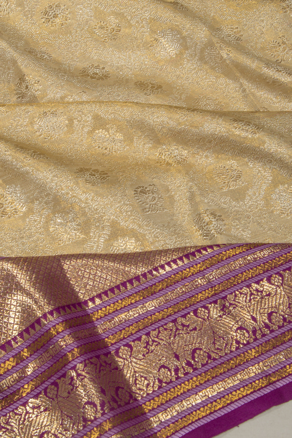 Kanchipuram Silk Tissue Jaal And Butta Cream Saree