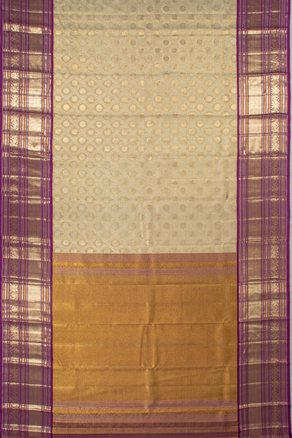 Kanchipuram Silk Tissue Jaal And Butta Cream Saree