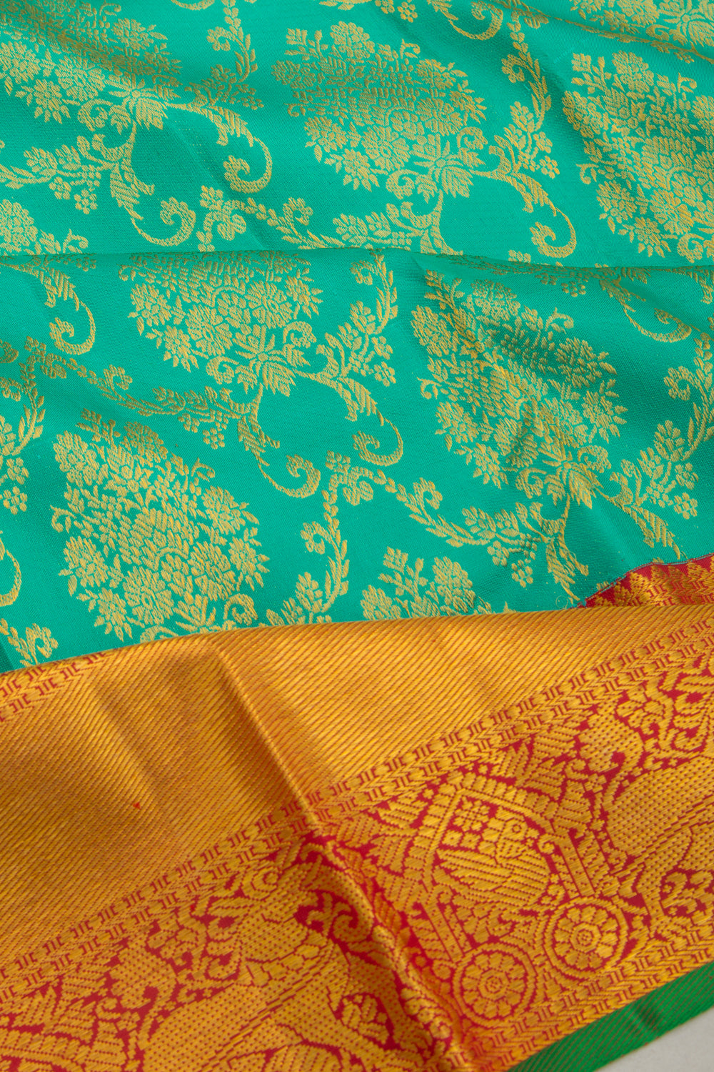 Taranga Kanchi Silk Jaal And Butta Sea Green Saree