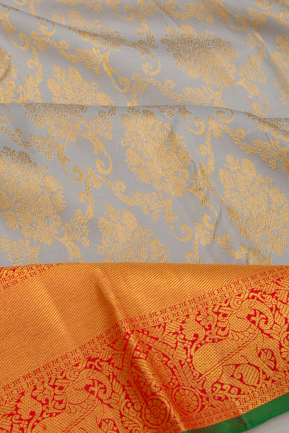 Taranga Kanchi Silk Jaal And Butta Grey Saree