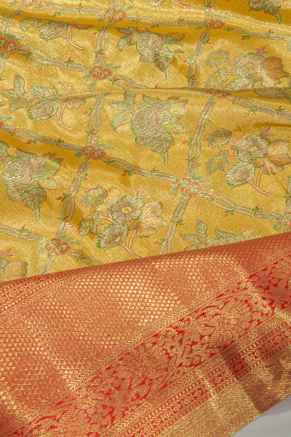 Taranga Kanchi Silk Tissue Criss Cross Checks And Butta Gold Saree