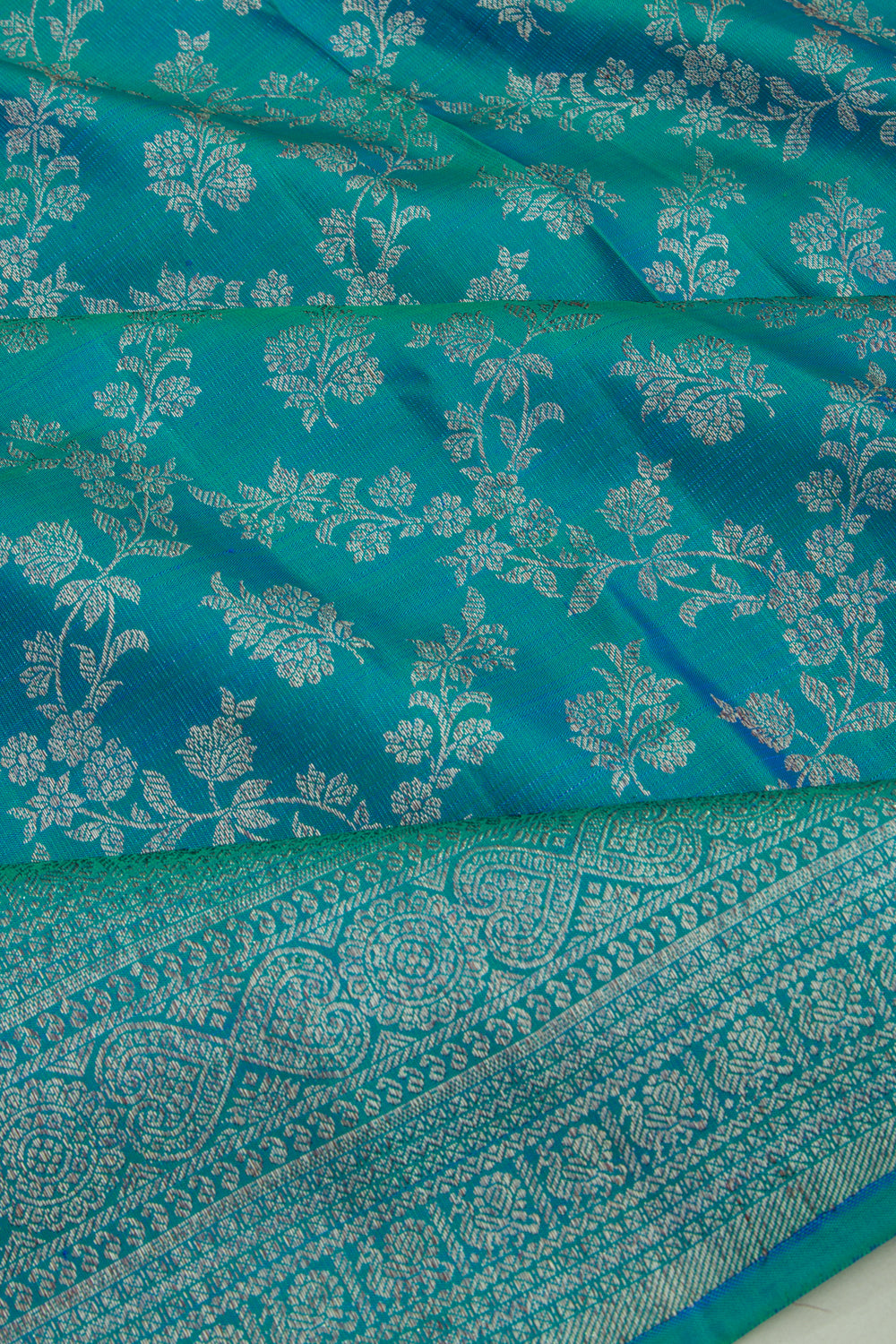 Kanchipuram Silk Jaal And Butta Dual Tone Blue And Green Saree