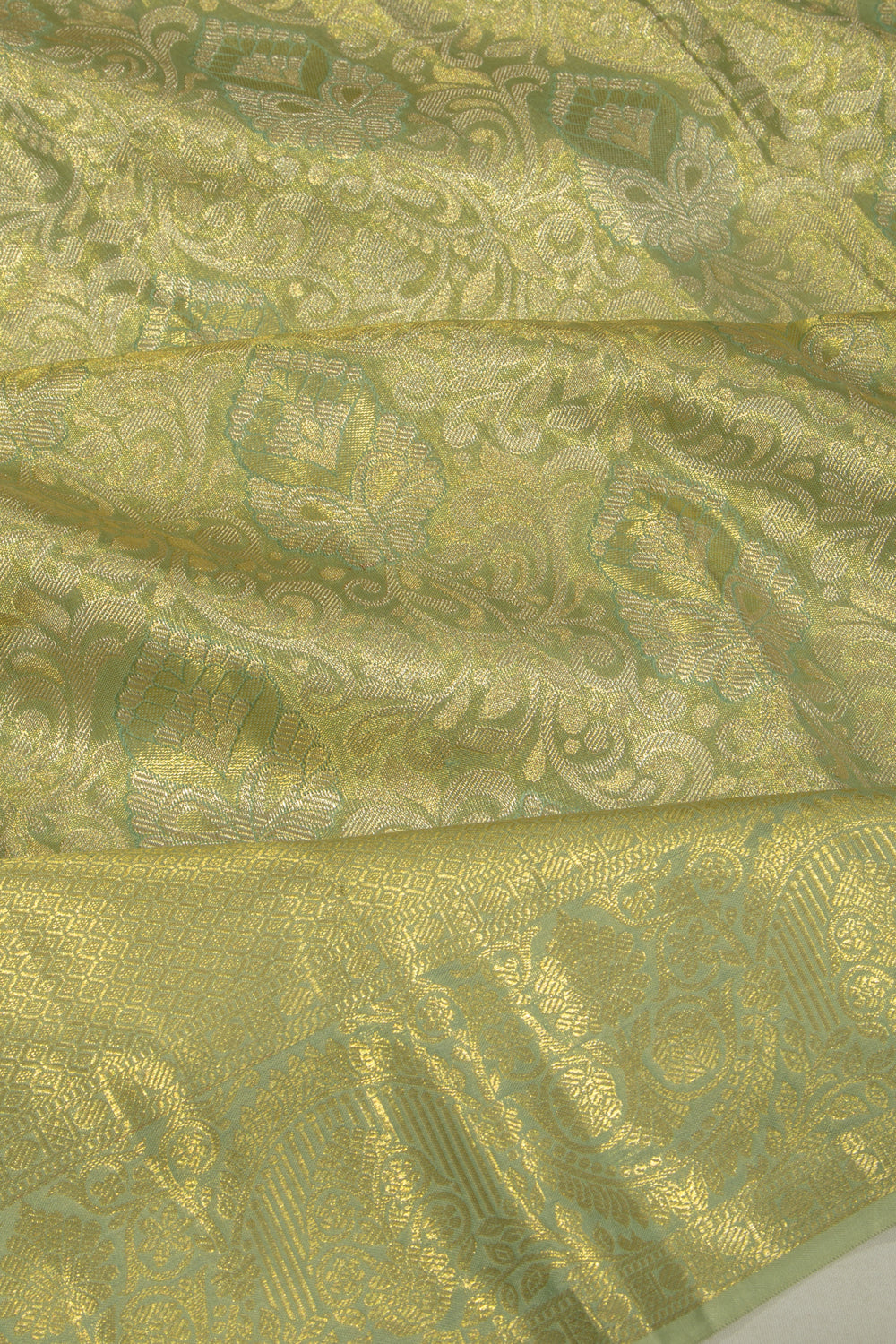 Taranga Kanchi Silk Tissue Jaal Pastel Green Saree