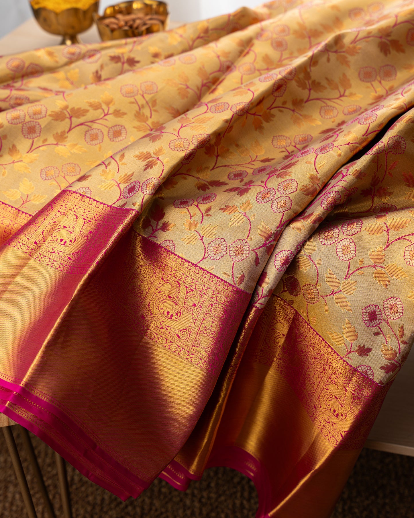 Taranga Kanchi Silk Jaal Tissue Gold Saree With Rakhi and Gift Box