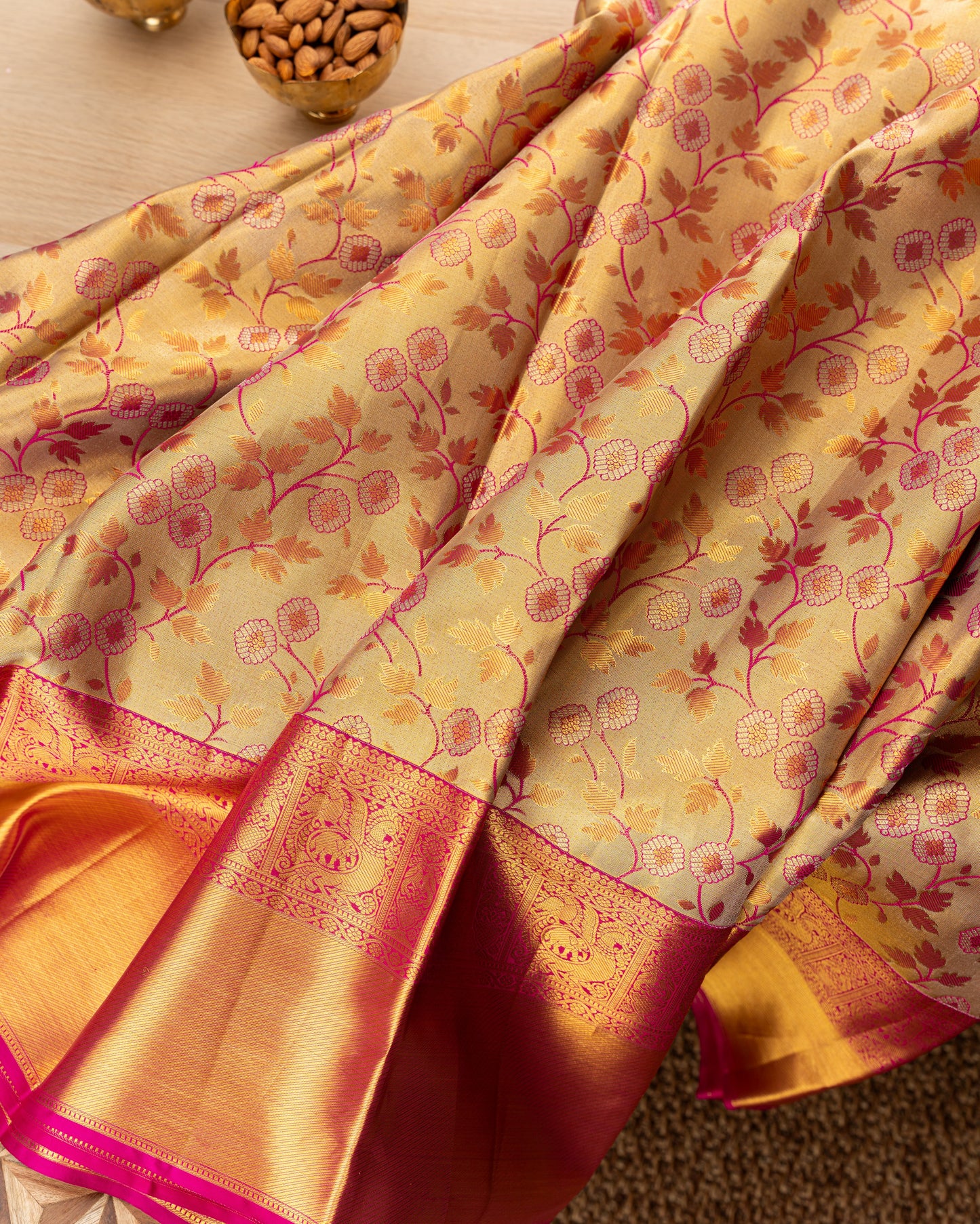 Taranga Kanchi Silk Jaal Tissue Gold Saree With Rakhi and Gift Box