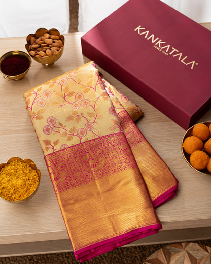 Taranga Kanchi Silk Jaal Tissue Gold Saree With Rakhi and Gift Box