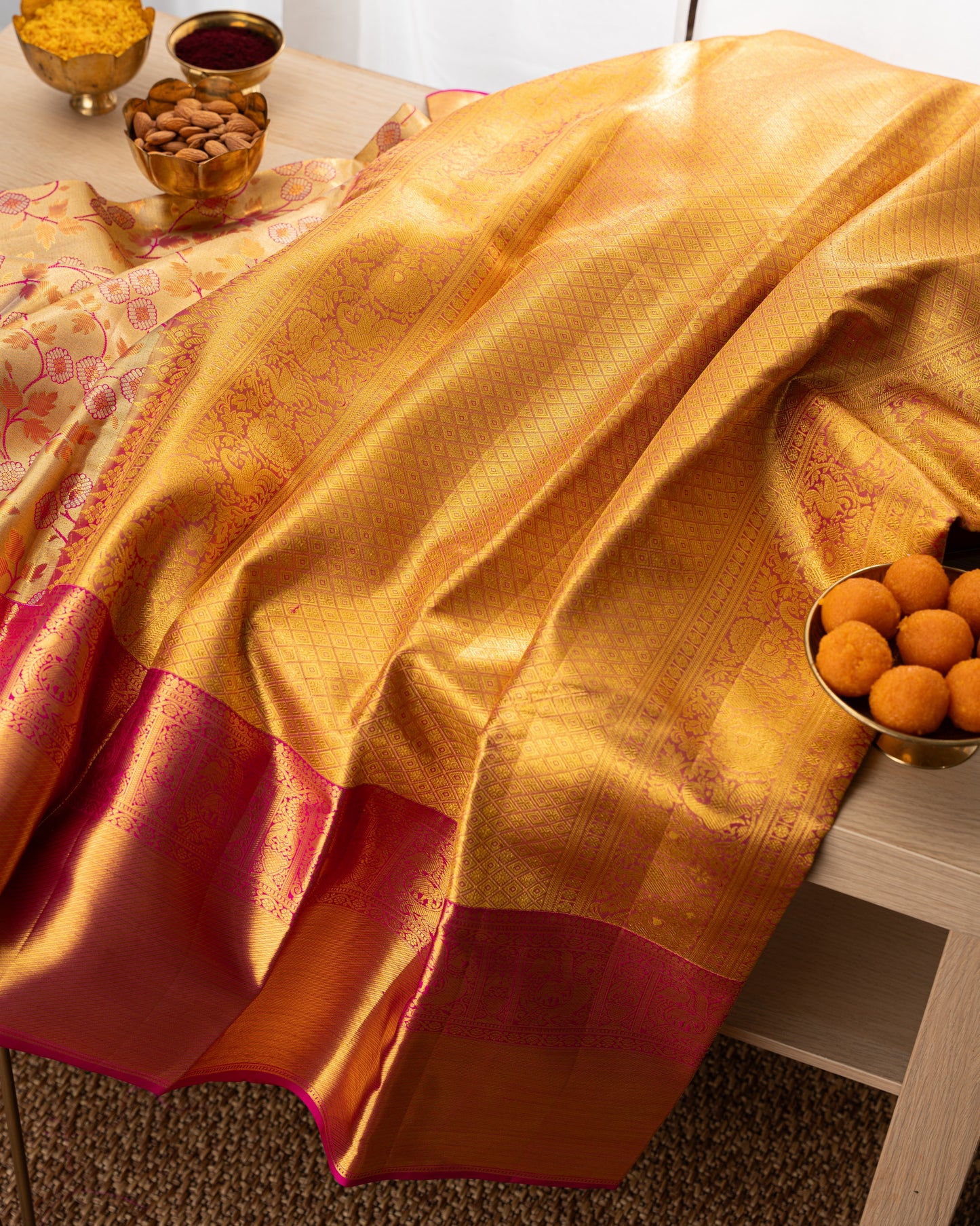 Taranga Kanchi Silk Jaal Tissue Gold Saree With Rakhi and Gift Box