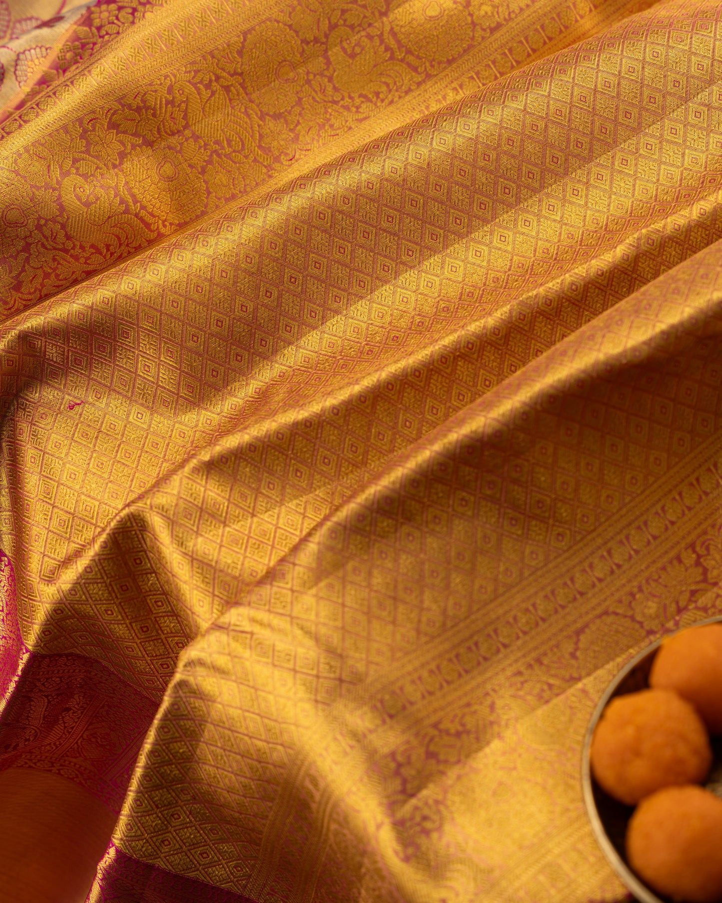 Taranga Kanchi Silk Jaal Tissue Gold Saree With Rakhi and Gift Box