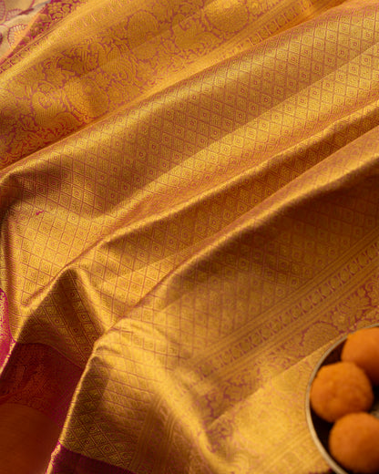Taranga Kanchi Silk Jaal Tissue Gold Saree With Rakhi and Gift Box