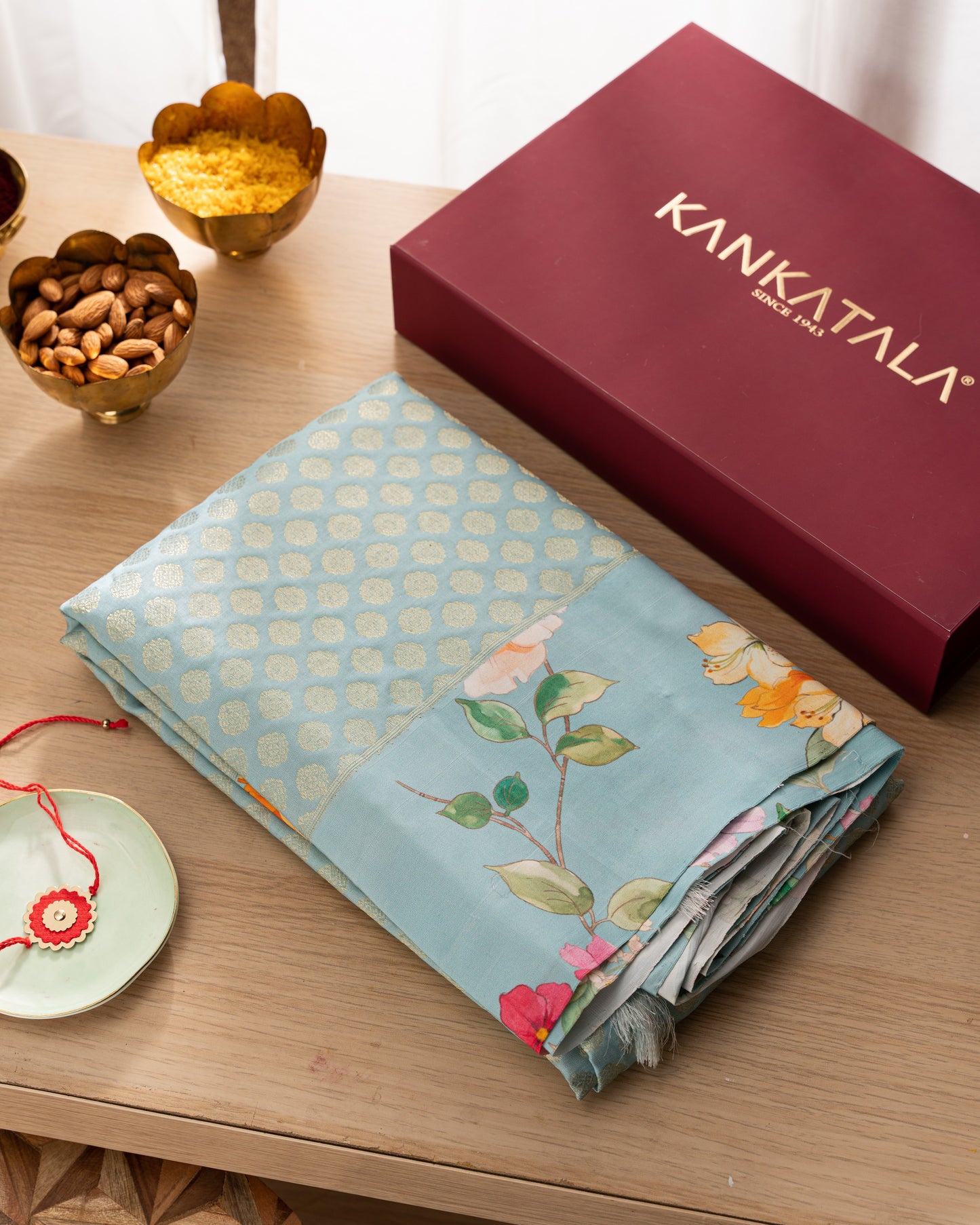 Kanchipuram Silk Brocade Blue Saree With Floral Print Border With Rakhi And Gift Box