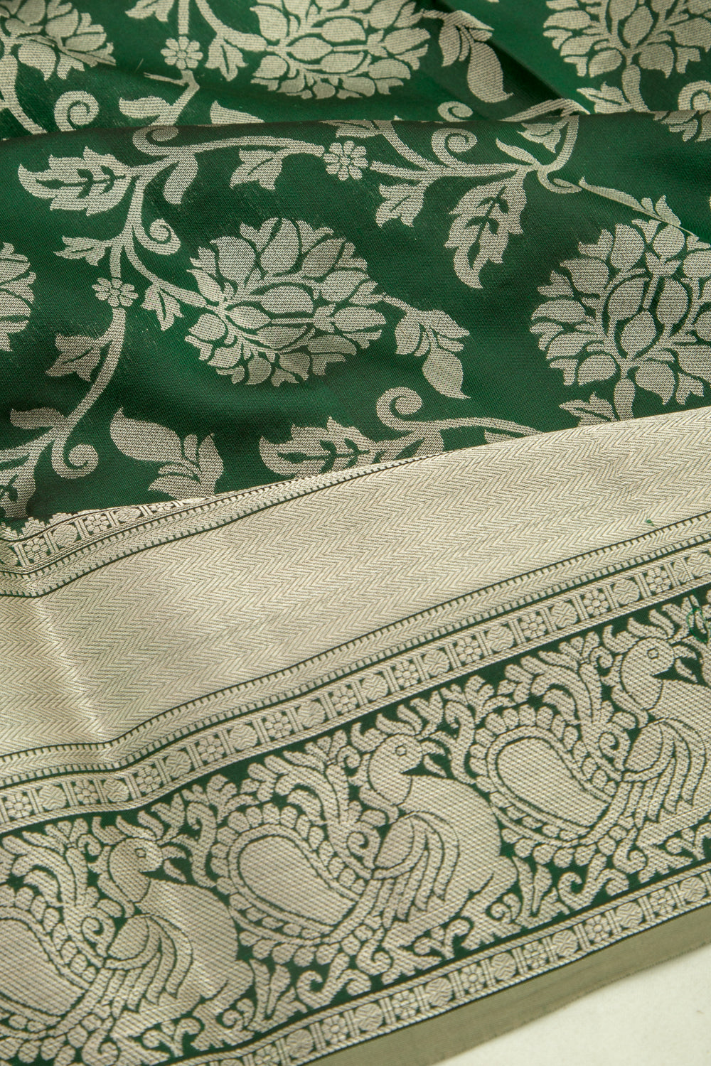 Taranga Kanchi Silk Jaal Bottle Green Saree