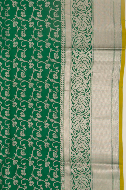 Taranga Kanchi Silk Jaal Bottle Green Saree