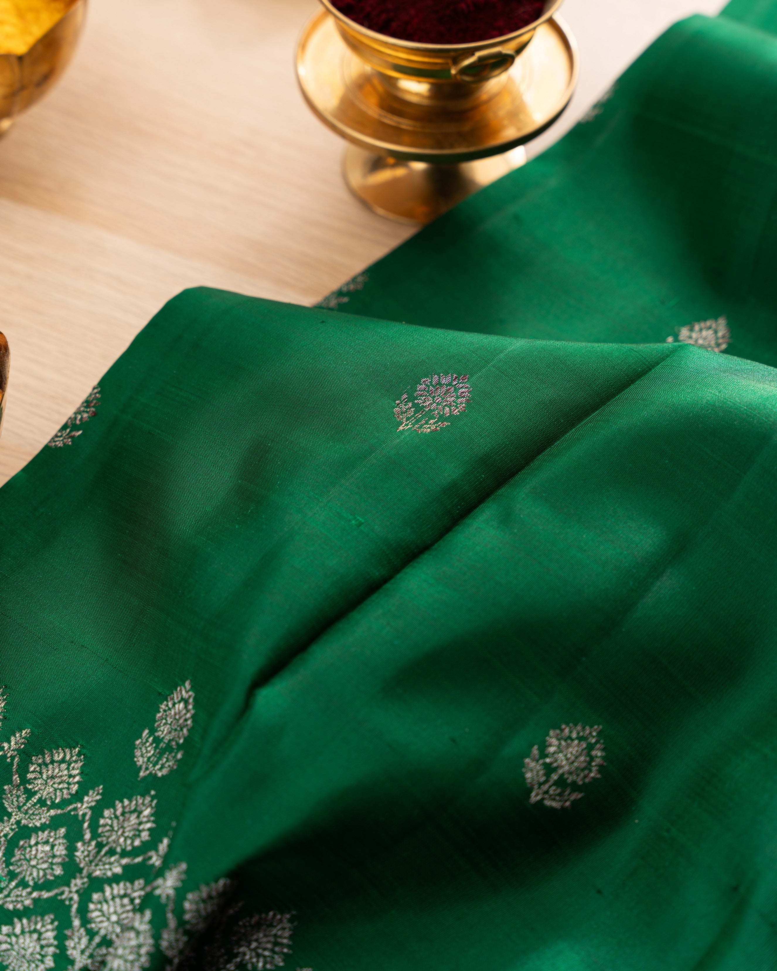 Taranga Kanchi Silk Antique Zari Butta Dark Green Saree With Rakhi and Gift Box