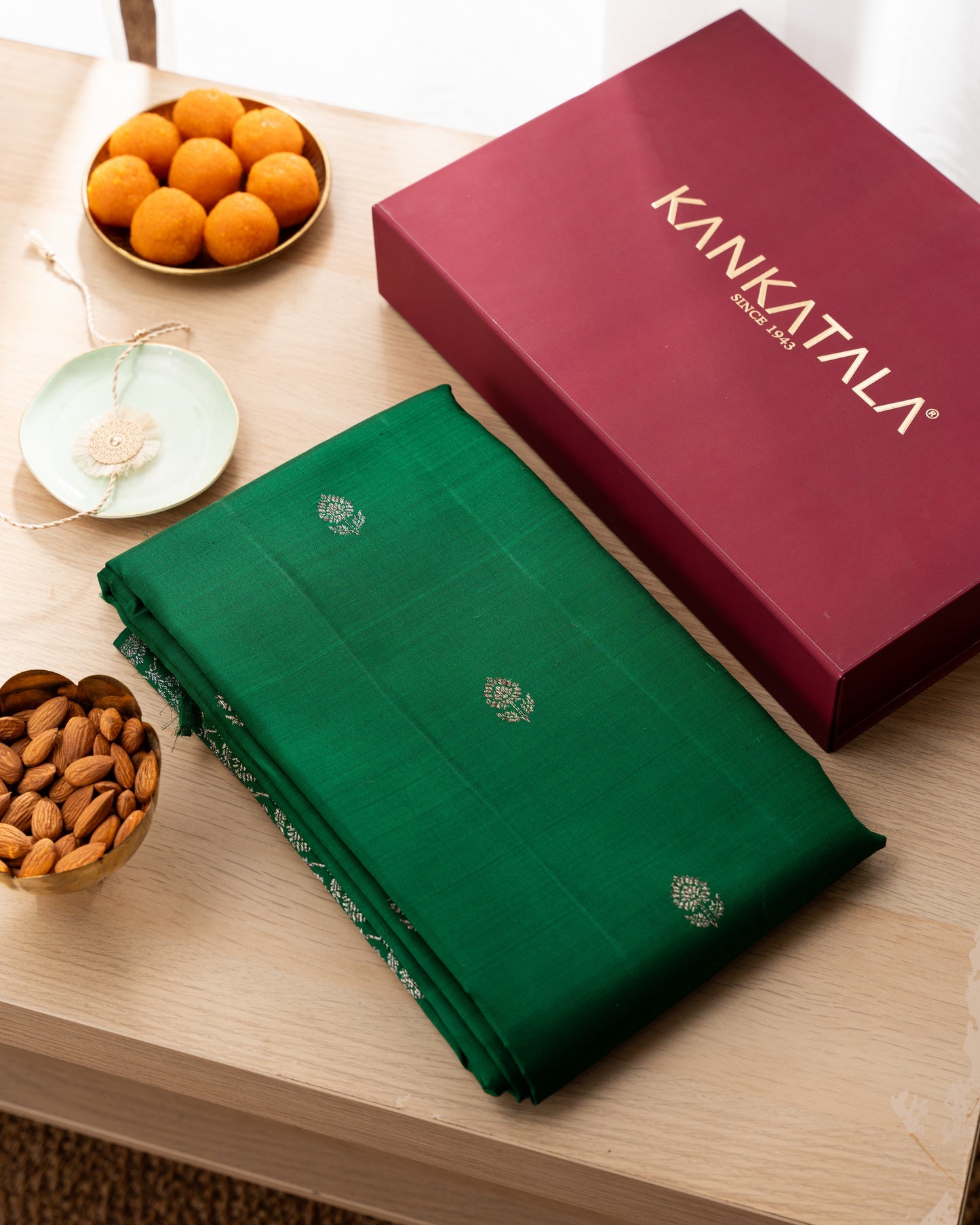 Taranga Kanchi Silk Antique Zari Butta Dark Green Saree With Rakhi and Gift Box