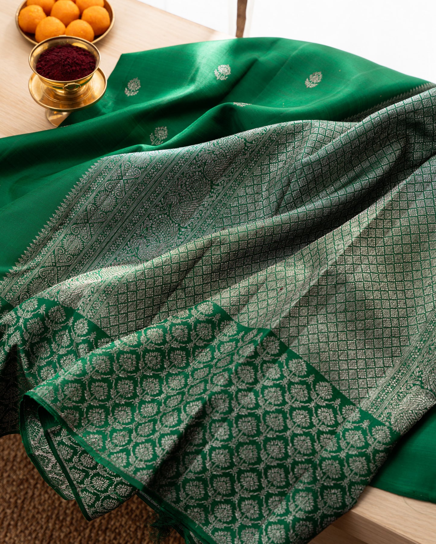 Taranga Kanchi Silk Antique Zari Butta Dark Green Saree With Rakhi and Gift Box