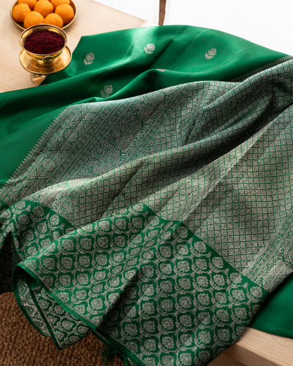 Taranga Kanchi Silk Antique Zari Butta Dark Green Saree With Rakhi and Gift Box
