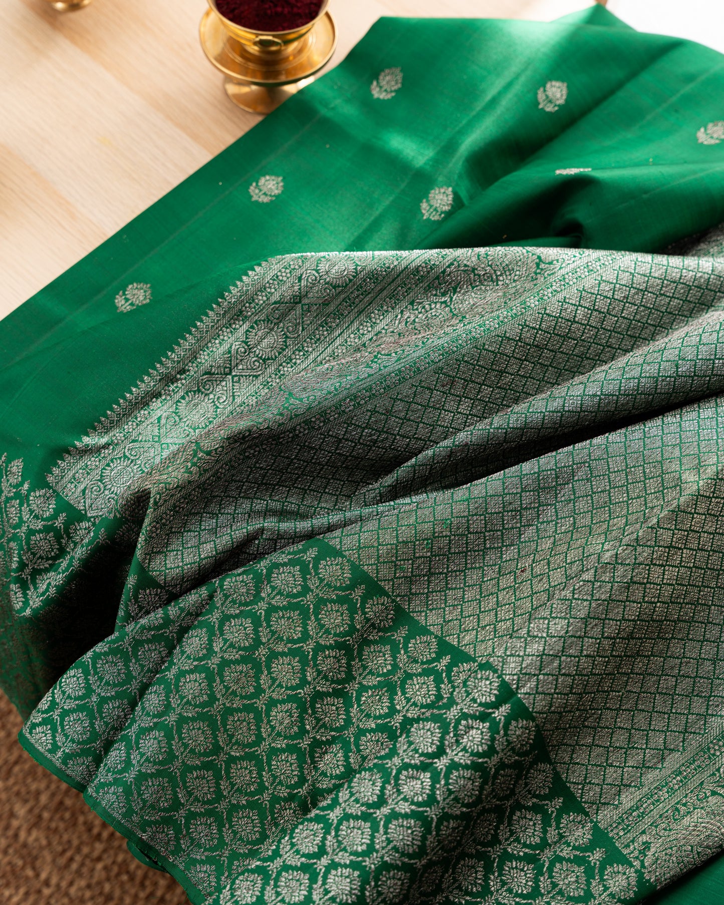 Taranga Kanchi Silk Antique Zari Butta Dark Green Saree With Rakhi and Gift Box