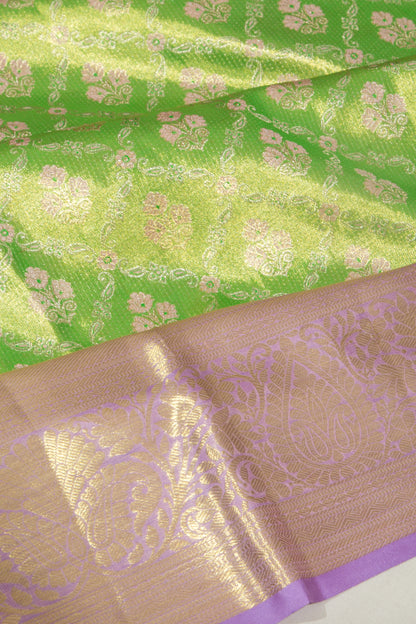 Taranga Kanchi Silk Tissue Jaal And Butta Green Saree
