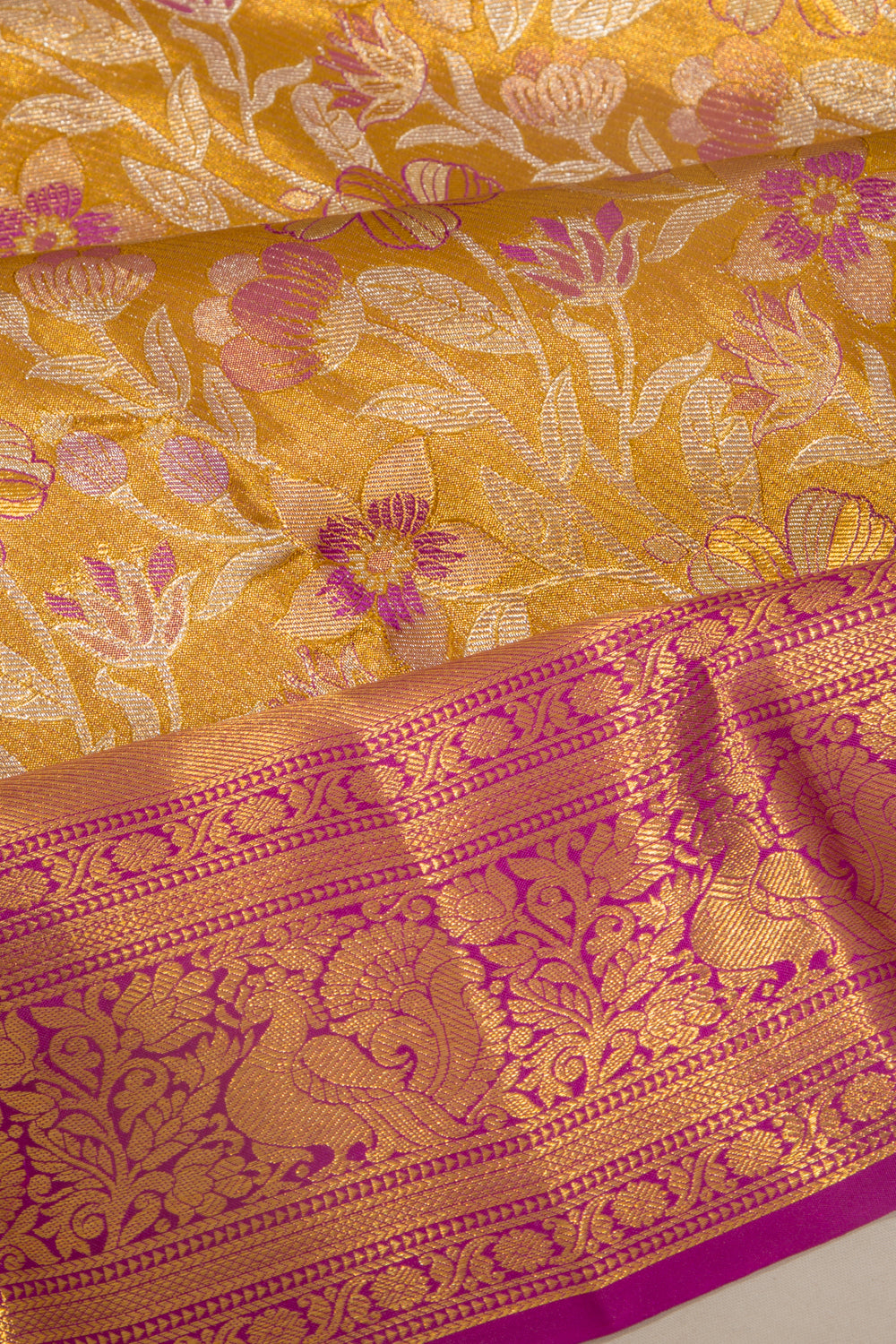Taranga Kanchi Silk Tissue Jaal Gold Saree