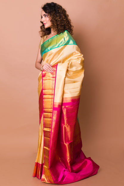 Kanchipuram Silk Butta Cream Saree With Ganga Jamuna Border