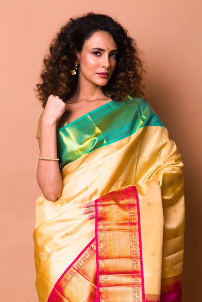 Kanchipuram Silk Butta Cream Saree With Ganga Jamuna Border