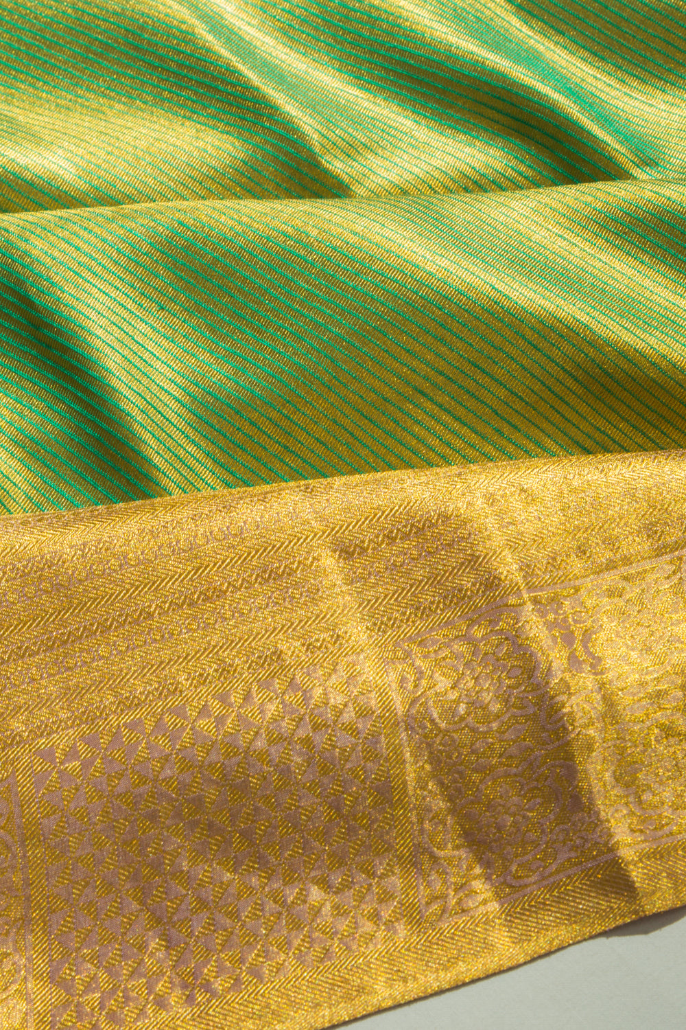 Taranga Kanchi Silk Tissue Diagonal Lines Green Saree