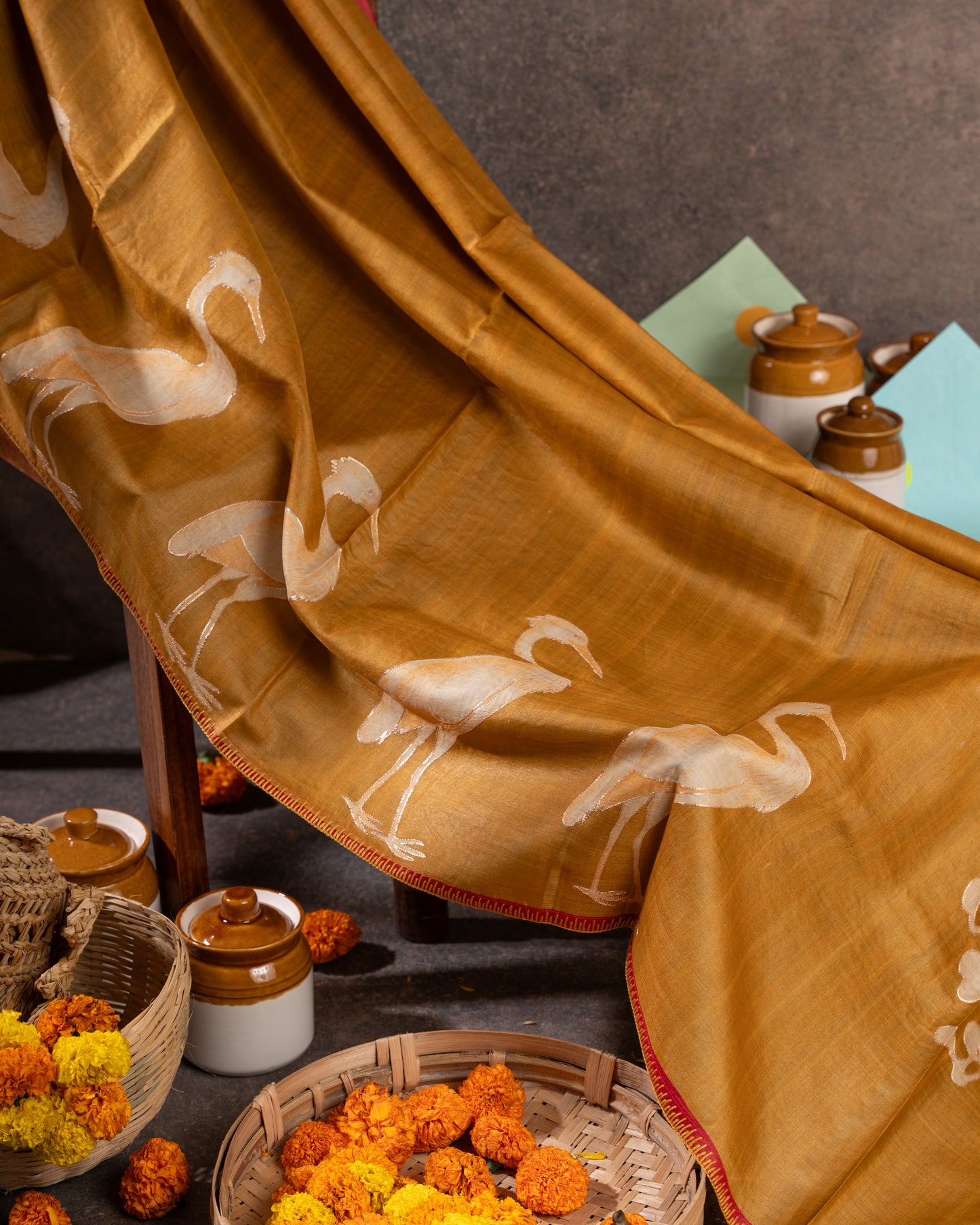 Mustard Tussar Floral Saree with Gold Zari and Red Border