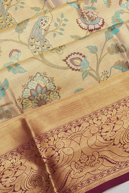 Taranga Kanchi Silk Tissue Brocade Cream Saree