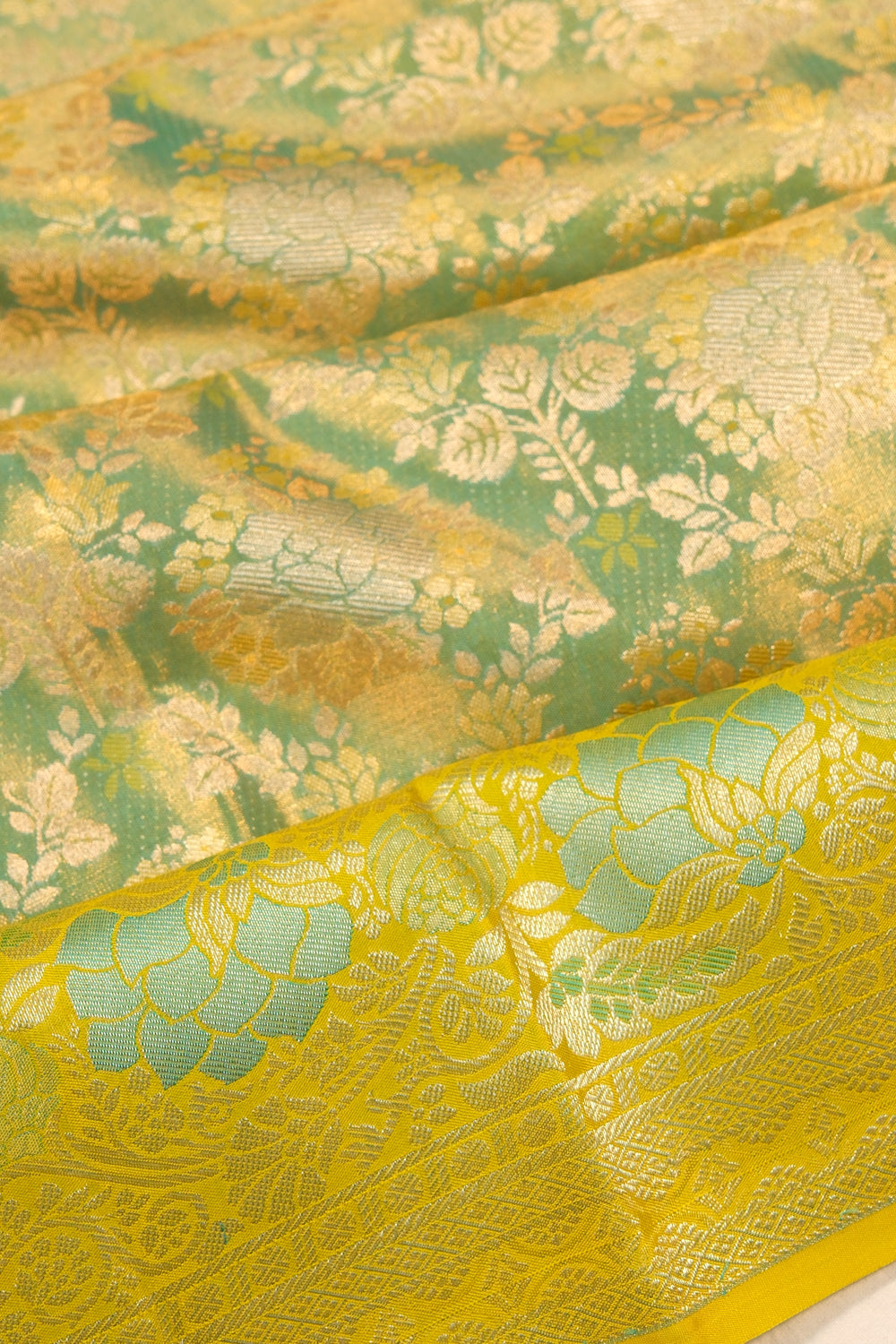 Taranga Kanchi Silk Tissue Brocade Green Saree
