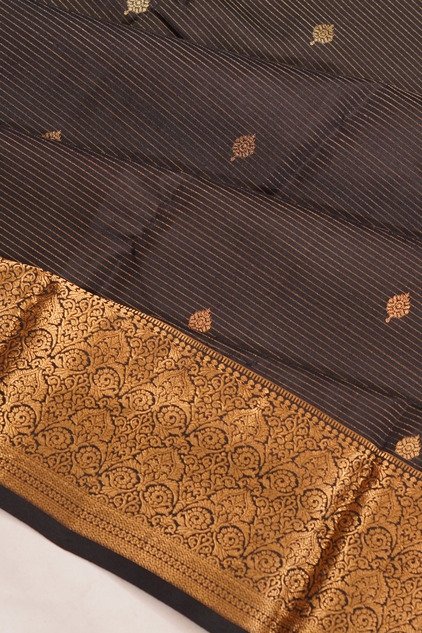 Taranga Kanchi Silk Oosi Lines And Butta Black Saree