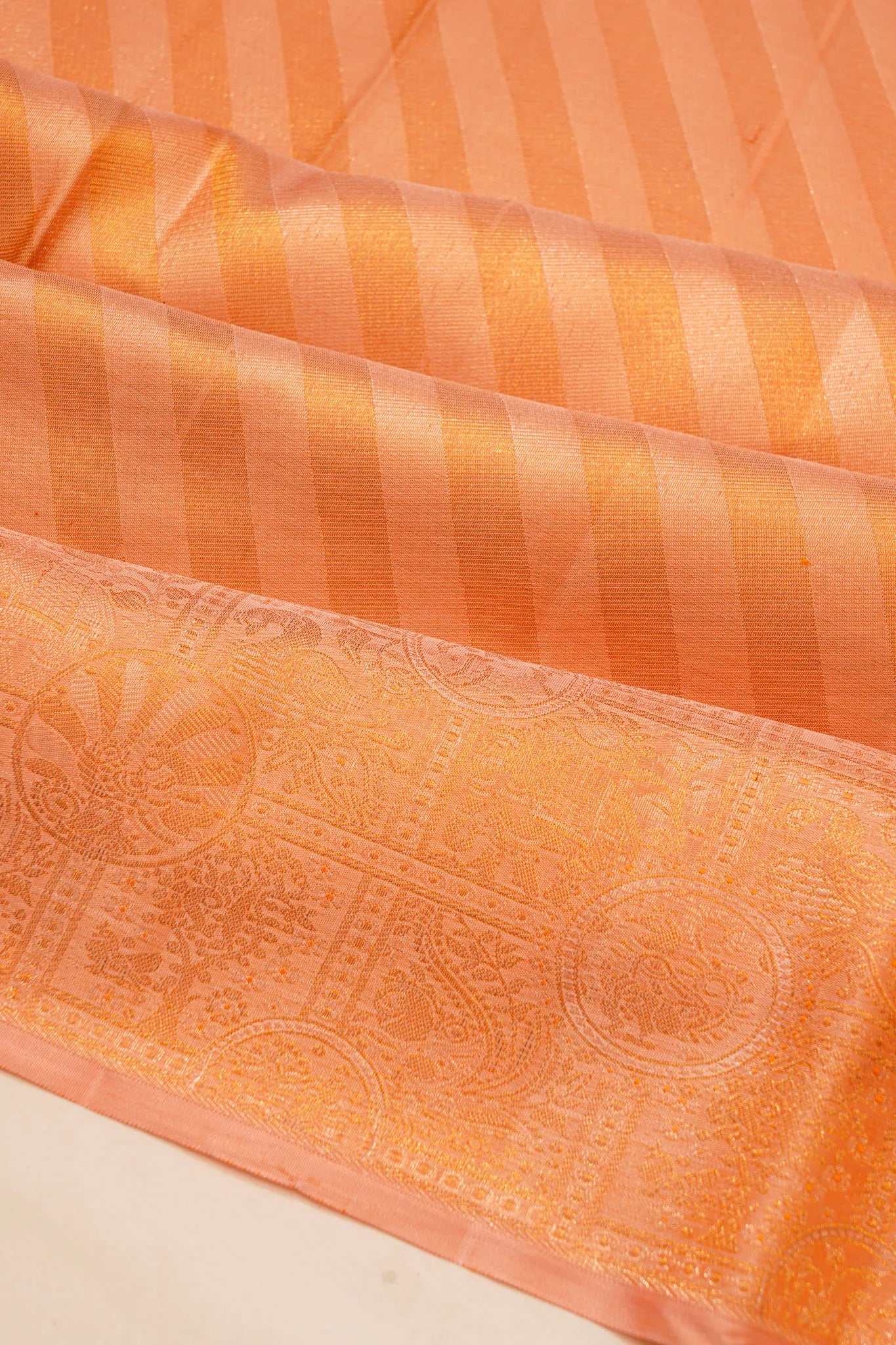 kanchipuram-silk-tissue-diagonal-lines-orange-saree-1214966347