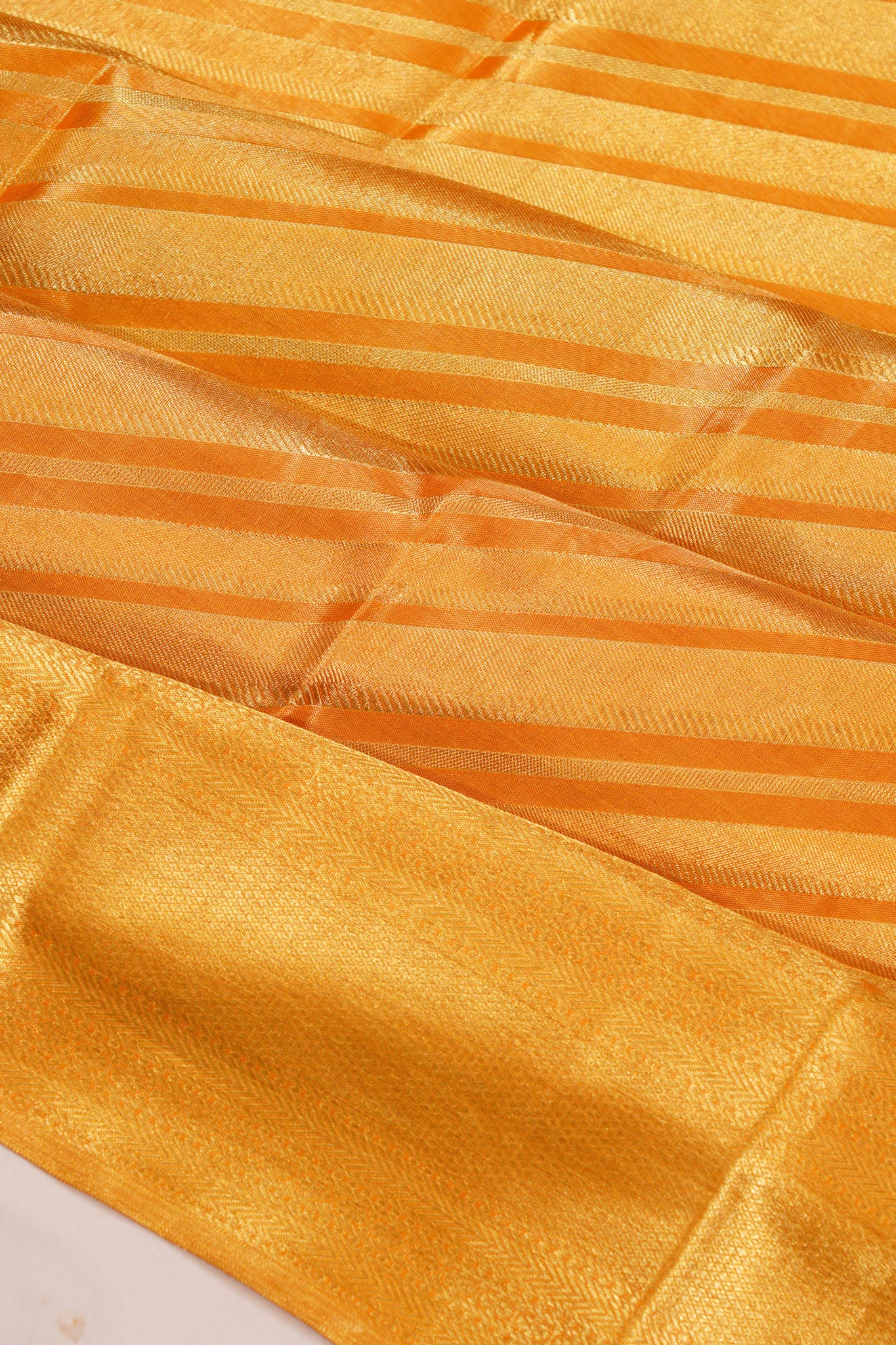 Taranga Kanchi Silk Tissue Lines Gold Saree