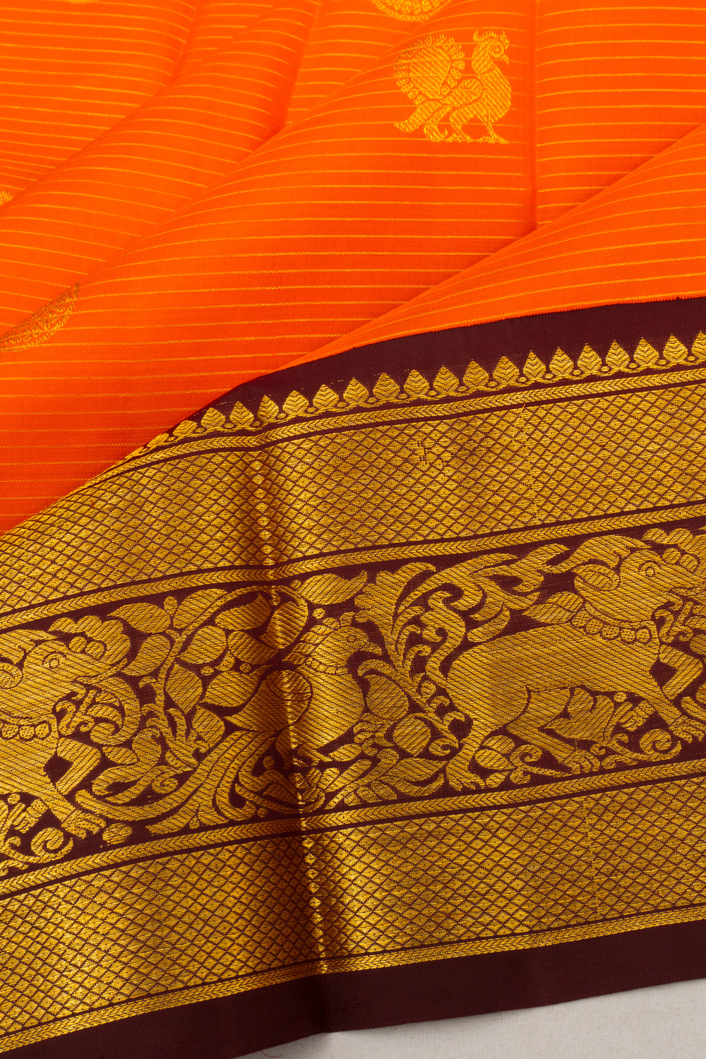 Kanchipuram Silk Oosi Lines And Butta Orange Saree