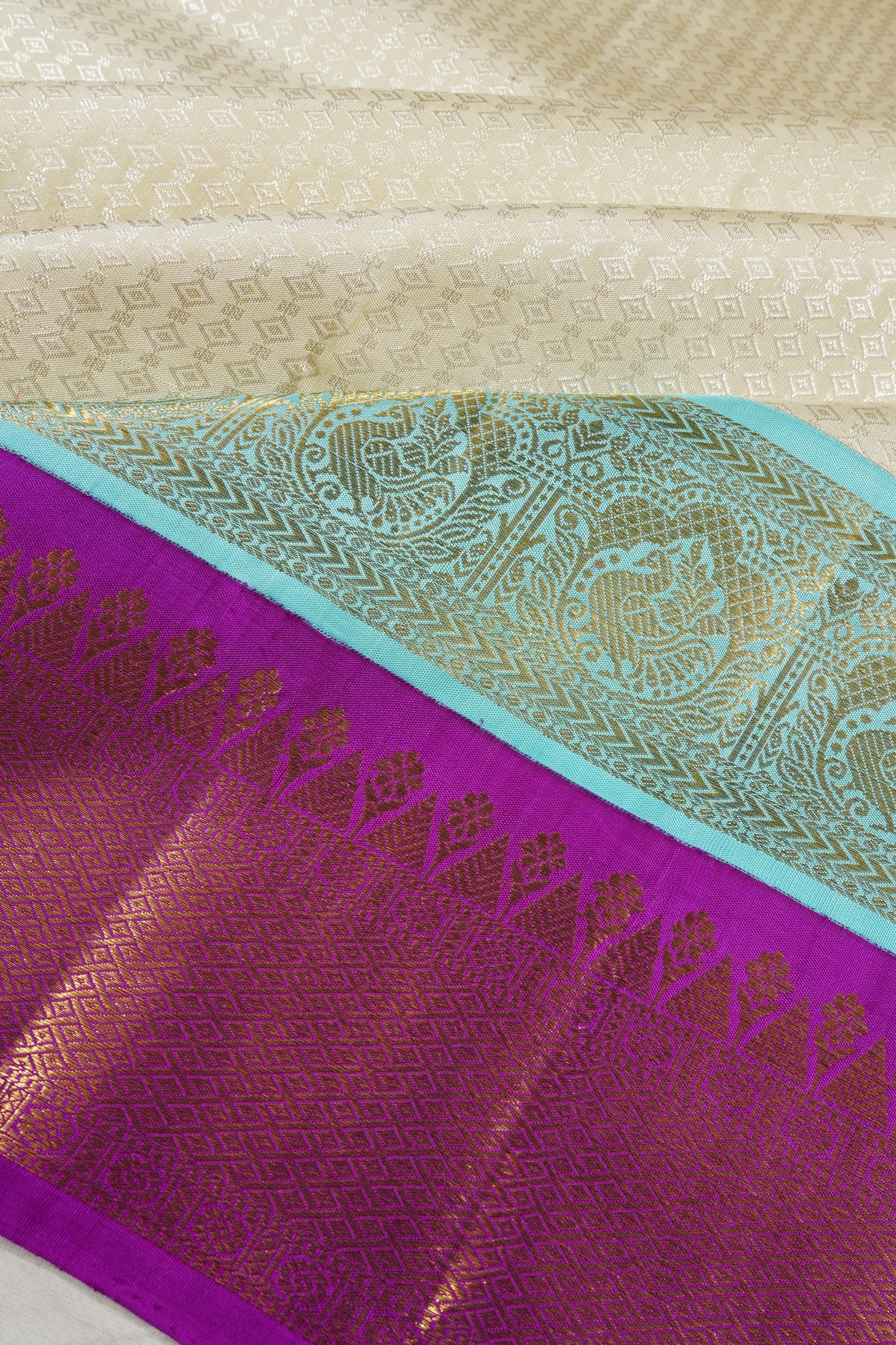Kanchipuram Silk Brocade Off White Saree With Double Korvai Border