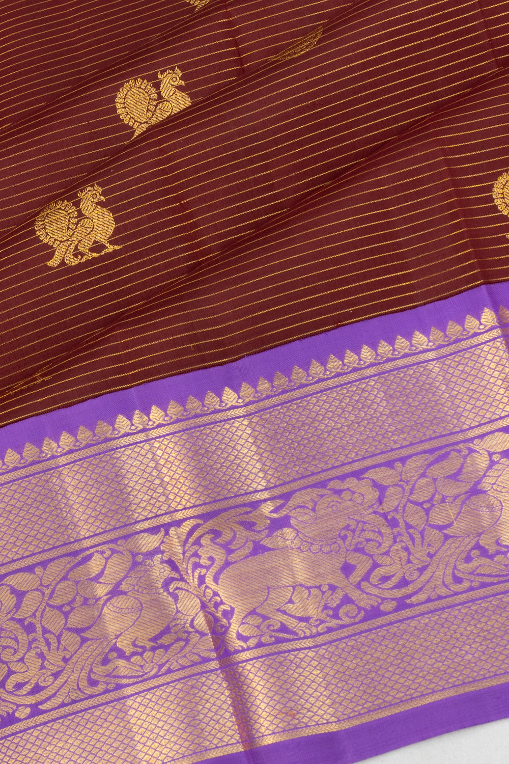 Kanchipuram Silk Oosi Lines And Butta Brown Saree