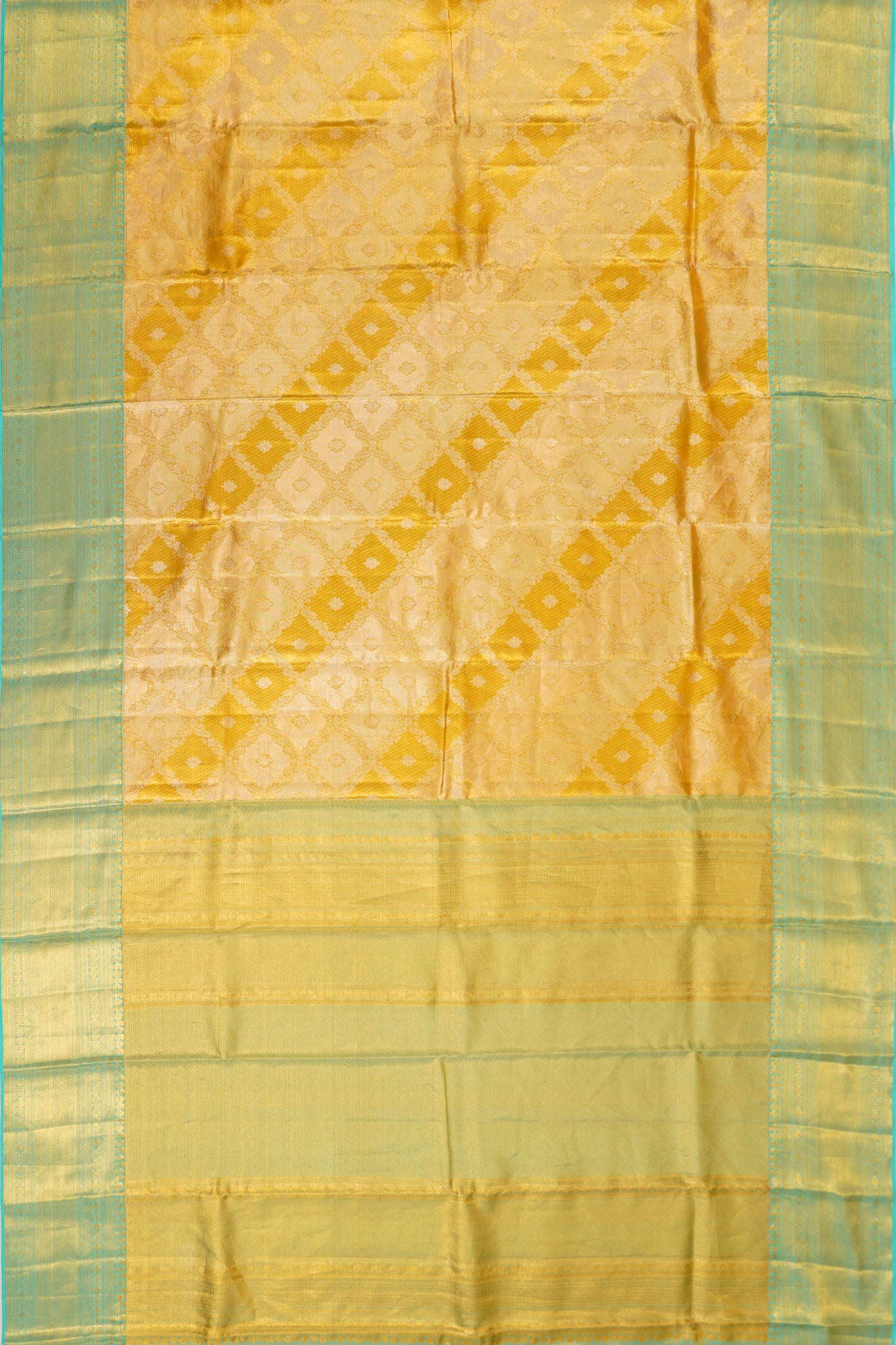 Taranga Kanchi Silk Tissue Brocade Gold Saree