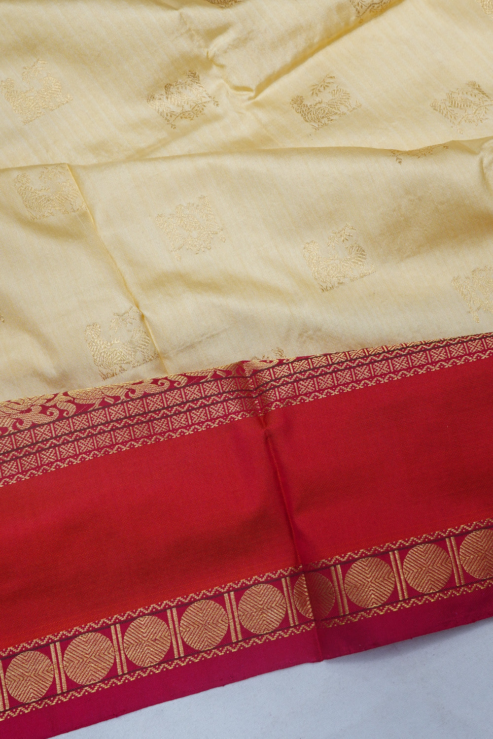 Kanchipuram Silk Butta Cream Saree With Ikat Blouse