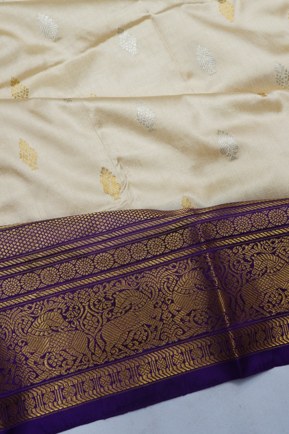 Kanchipuram Silk Butta Cream Saree With Ikat Blouse