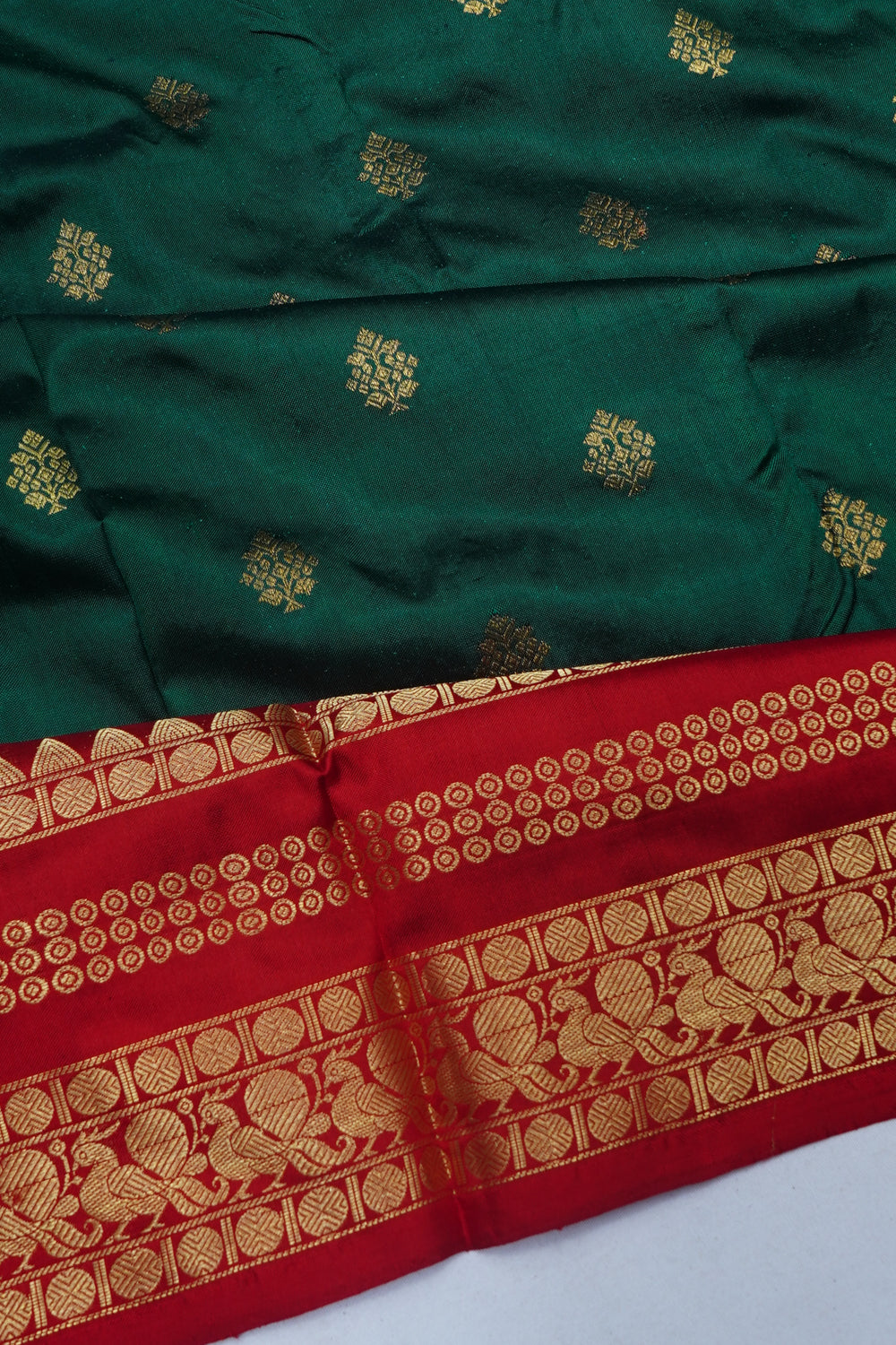 Kanchipuram Silk Butta Bottle Green Saree With Ikat Blouse