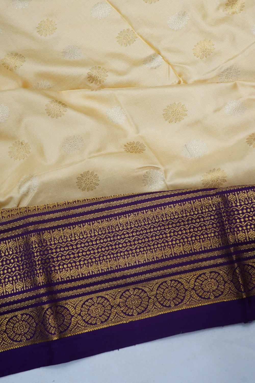 Kanchipuram Silk Butta Off White Saree With Ikat Blouse