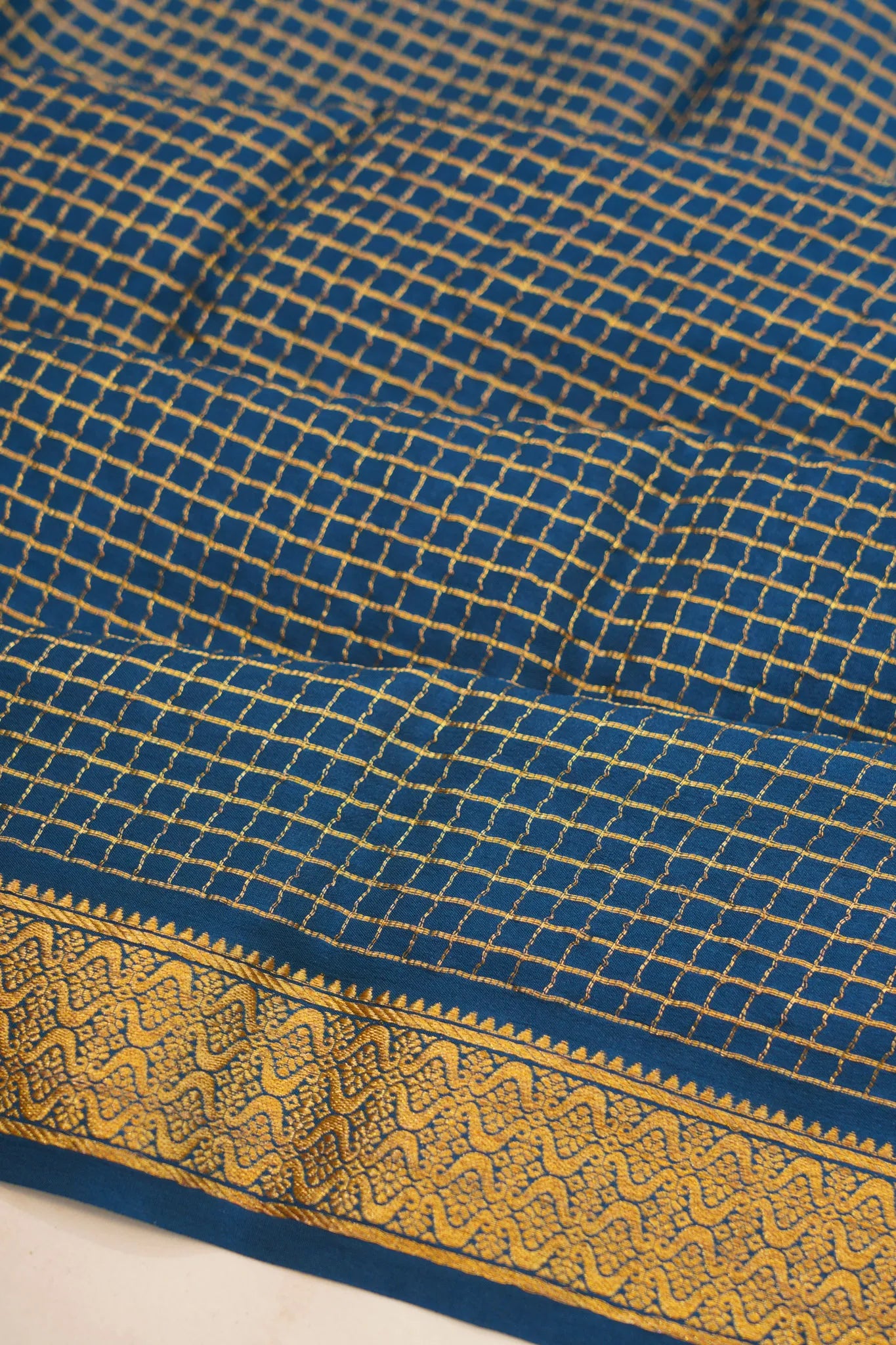 georgette-crepe-checks-teal-blue-saree-with-kalamkari-border-1215372835