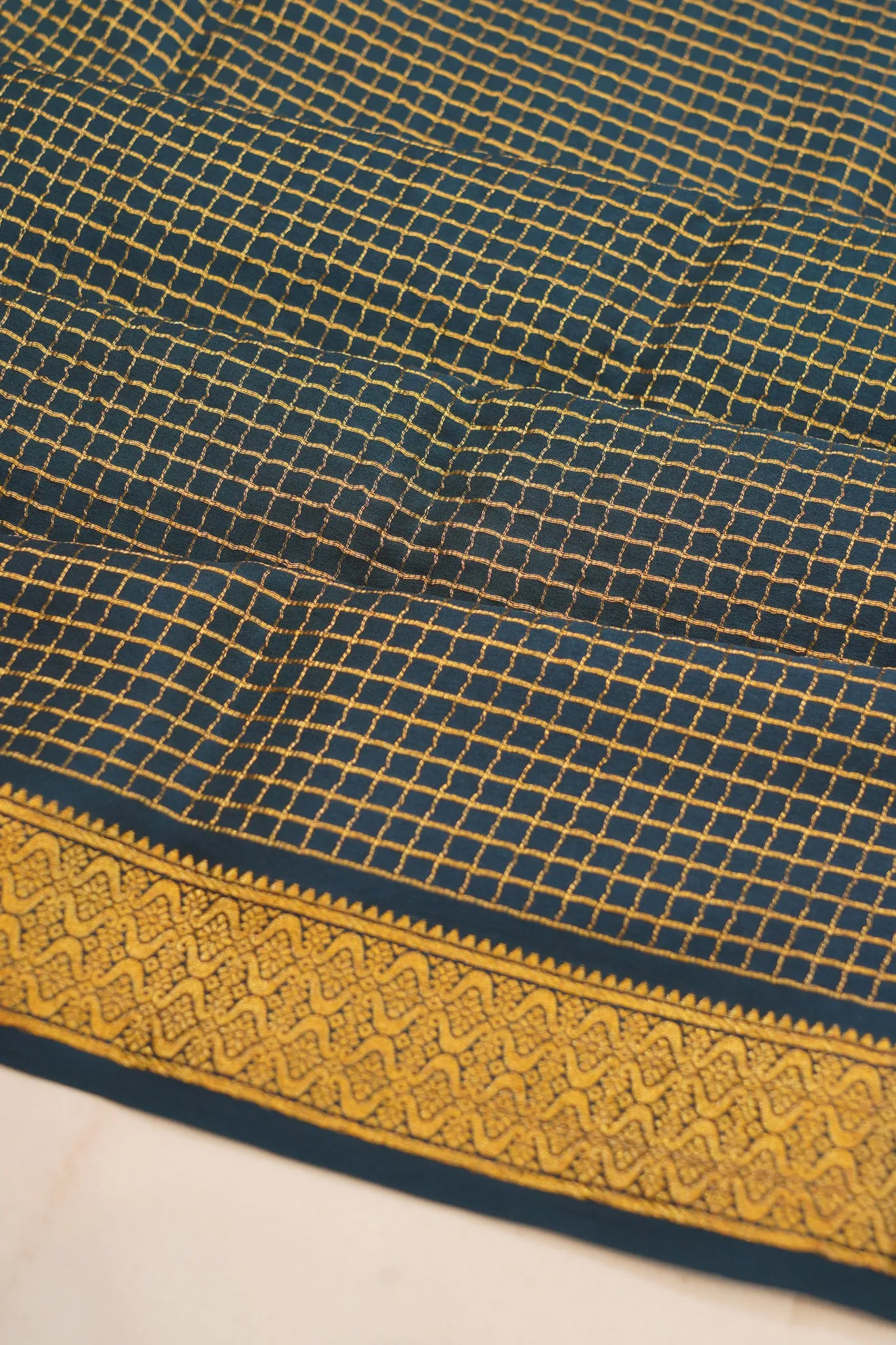 georgette-crepe-checks-dark-blue-saree-with-kalamkari-border-1215372839