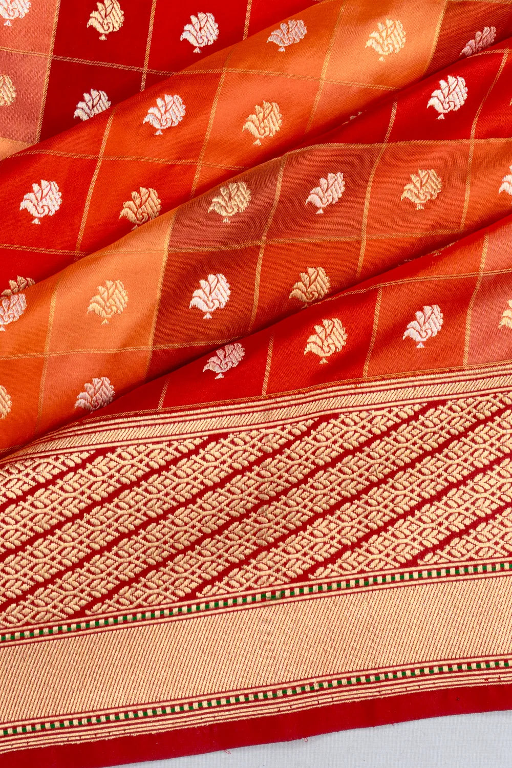 Banarasi Silk Kadwa Checks And Butta Dual Tone Orange And Red Saree