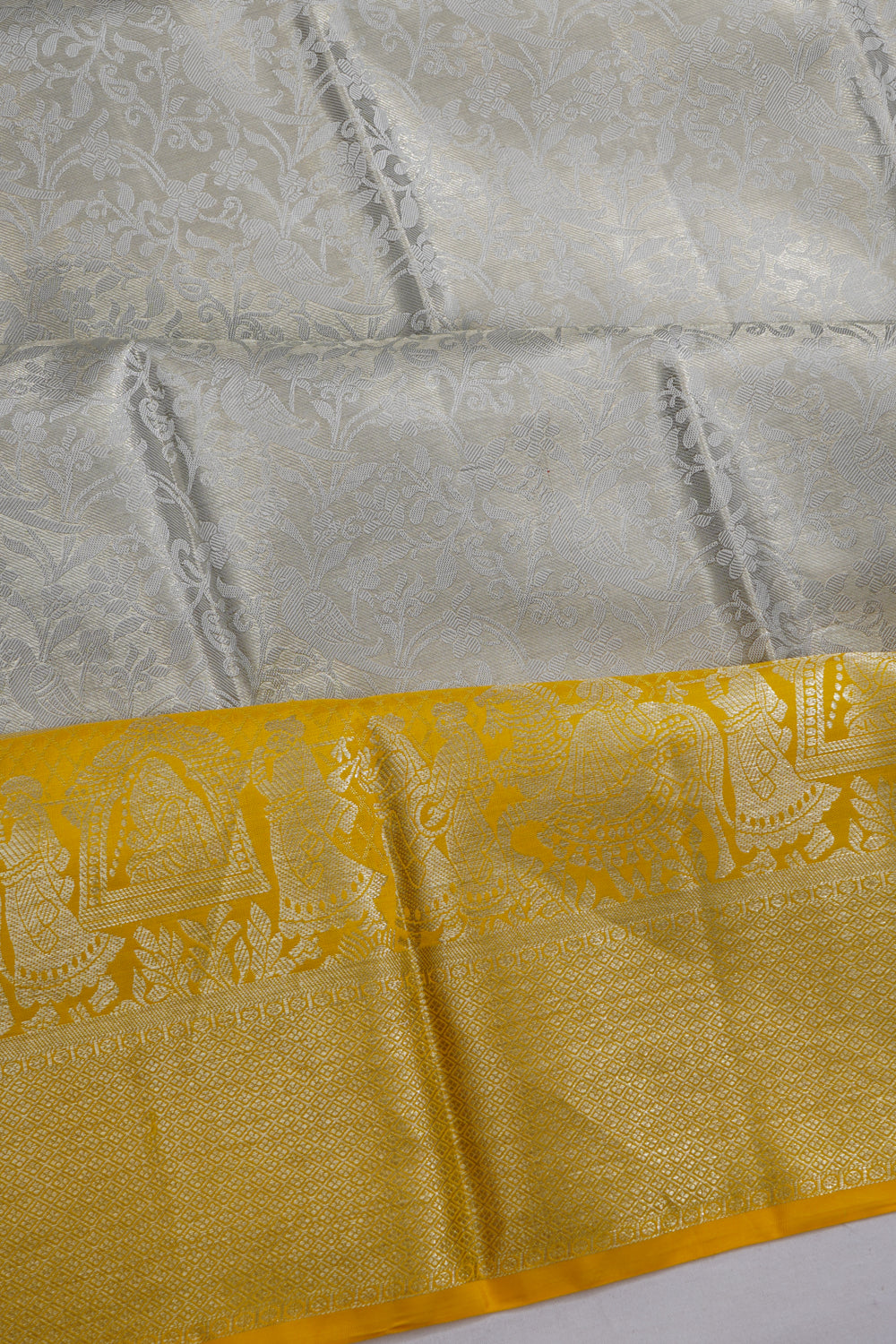 Taranga Kanchi Silk Tissue Brocade Silver Saree