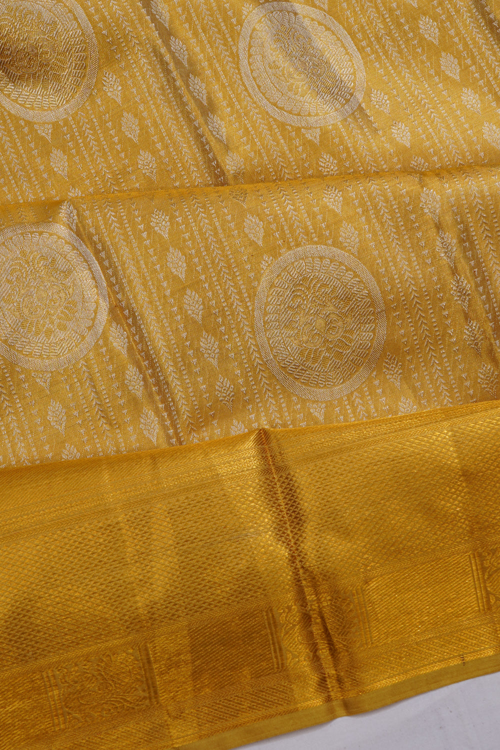 Taranga Kanchi Silk Tissue Brocade Gold Saree