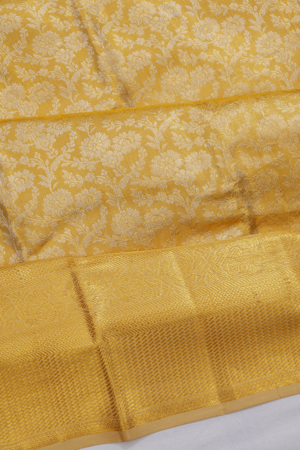 Taranga Kanchi Silk Tissue Brocade Gold Saree