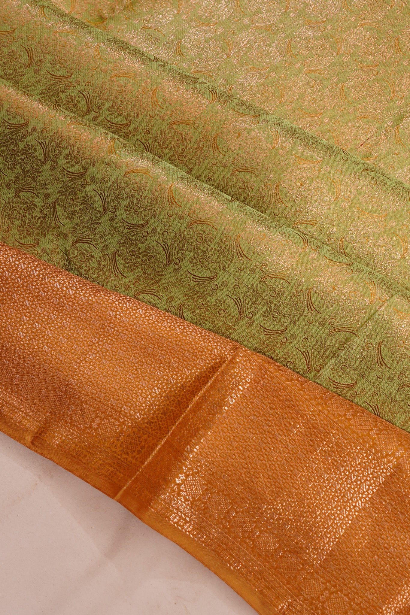 Taranga Kanchi Silk Tissue Brocade Green Saree
